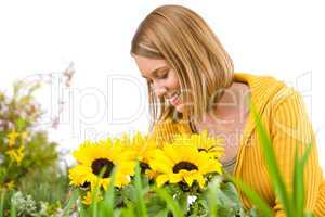 Gardening - portrait of smiling woman with sunflowers