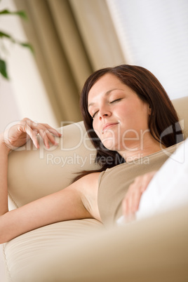 Beautiful woman sleeping on sofa