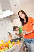 Young woman having coffee in the kitchen