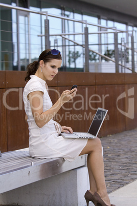 Female working outside with laptop