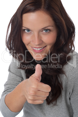 Happy young woman showing thumbs-up