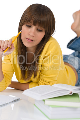 Student - female teenager write homework with book