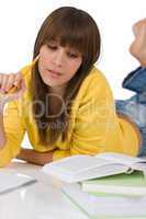 Student - female teenager write homework with book