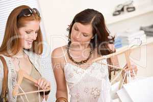 Fashion shopping -  Two happy young woman choose clothes