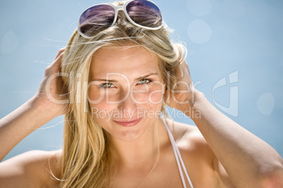 Happy blond woman enjoy summer sun on seashore