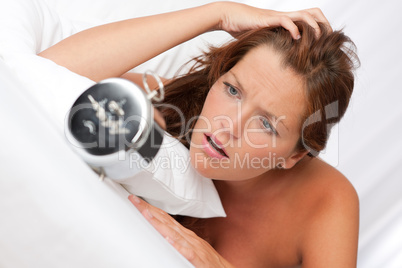 White lounge - Shocked woman watching alarm clock