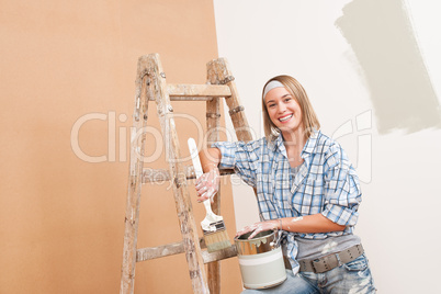 Home improvement: Smiling woman with paint