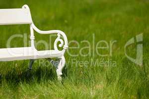 Spring and summer - White romantic bench in meadow