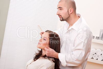 Professional hairdresser comb customer at salon