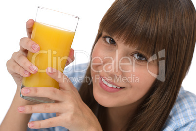 Female teenager with healthy juice for breakfast