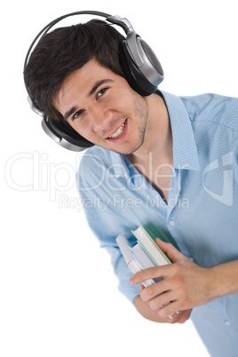 Male student with headphones holding books