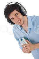 Male student with headphones holding books