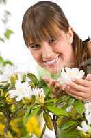 Gardening - Portrait of woman with Rhododendron flower