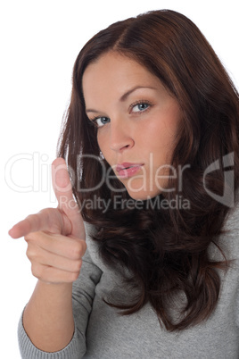 Portrait of long brown hair woman pointing