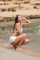 Young attractive woman on the beach