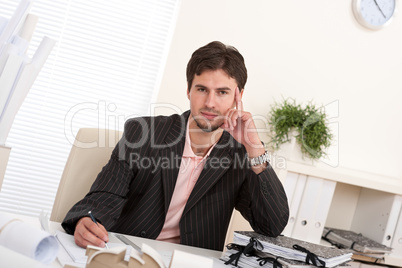 Successful professional businessman working at office