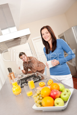 Smiling woman and man in the kitchen