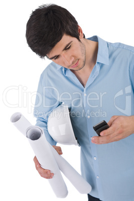 Male architect student with helmet and plans