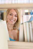 Student in library - cheerful woman hold book