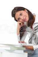 Teenager with books and laptop