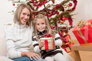 Happy blond woman with child on Christmas