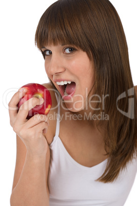 Female teenager eat apple for breakfast