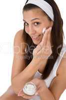 Beauty facial care - Young woman apply moisturizer