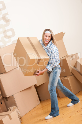 Moving house: Woman holding big carton box