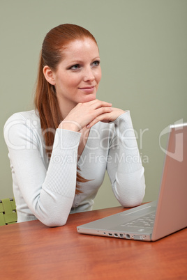 Long red hair  business woman with laptop