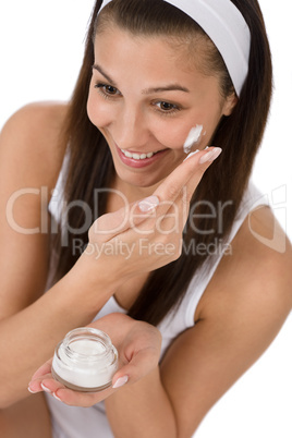 Beauty facial care - Young woman apply moisturizer