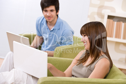 Student - two teenager with laptop in living room