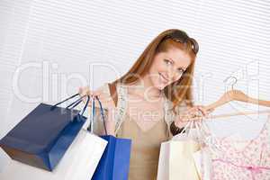 Fashion shopping - Happy woman with bag and dress