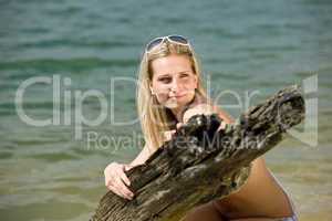 Beautiful woman enjoy summer sun at lakeside