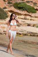 Young attractive woman on the beach