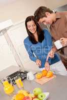 Happy couple preparing food together