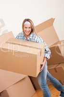 Moving house: Woman holding big carton box