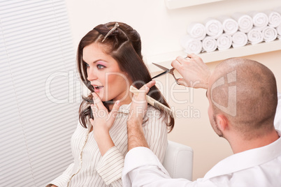 Professional hairdresser cut with scissors at salon