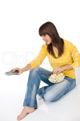 Happy female teenager watching television