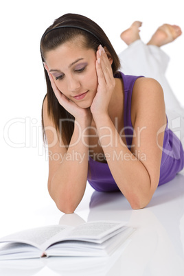 Happy teenager woman with book