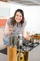 Cook - plus size woman in modern kitchen