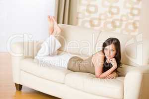 Young woman relax on sofa in lounge
