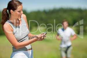 Young couple jogging outdoors in spring nature