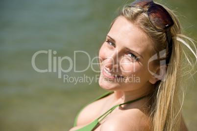 Smiling blond woman enjoy summer sun