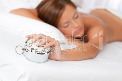 White lounge - Woman holding alarm clock