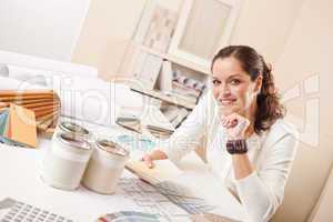 Young female interior designer at office