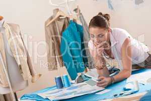 Female fashion designer working at studio