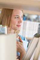 Student in library - happy woman hold book