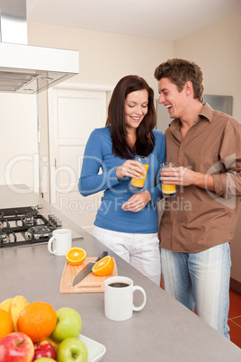 Young woman and man in the kitchen