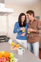 Young woman and man in the kitchen