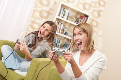 Students - Two female teenager playing video TV game